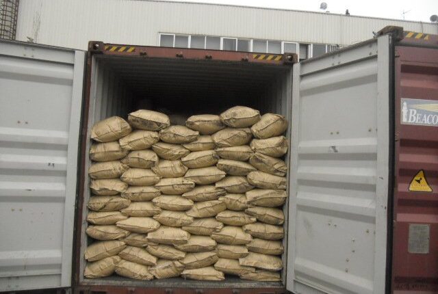 Kraft paper bags of humic acid loaded into a shipping container