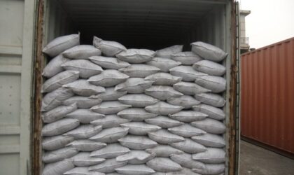 Woven bags of potassium humate loaded into a container